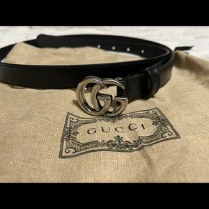 Black thin Gucci belt with silver hardware.